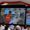 Ghi hình thực tế thao diễn tại các hiện trường lưới điện trên địa bàn Hà Nội. (Ảnh: PV/Vietnam+)