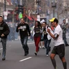 Hiện trường vụ đánh bom ở giải marathon Boston. (Nguồn: newyorker.com)
