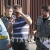 Cảnh sát áp giải một đối tượng trong nhóm mafia khét tiếng 'Ndranghetatrong hồi năm 2010. (Nguồn: AFP/TTXVN)