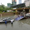 Cảnh ngập lụt trên đường phố miền Nam Trung Quốc. (Nguồn: THX/TTXVN) 