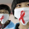 Học sinh ở Tế Nam, Trung Quốc tuyên truyền về HIV. (Nguồn: 163)