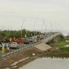 Cầu Chợ Kinh trên Tỉnh lộ 940 trong ngày thông xe. (Ảnh: Chanh Đa/TTXVN)