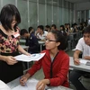 Sinh viên trong phòng thi trường Đại học Công Nghiệp Thành phố Hồ Chí Minh. (Ảnh: Phương Vy​/TTXVN)