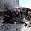 Hiện trường vụ đánh bom xe tỉnh trưởng ở Aden. (Nguồn: AFP/TTXVN)