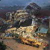 Nhiều tòa nhà bị đổ sập. (Nguồn: xinmin.cn)
