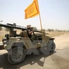 Lực lượng ủng hộ Chính phủ Iraq tiến vào khu vực làng al-Sejar, giáp Fallujah, tỉnh Anbar ngày 28/5. (Nguồn: AFP/TTXVN)