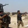 Lực lượng Chính phủ Iraq làm nhiệm vụ tại khu vực Shuhada, Fallujah ngày 15/6. (Nguồn: AFP/TTXVN)