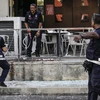 Cảnh sát Malaysia điều tra tại hiện trường một vụ tấn công. (Nguồn: EPA/TTXVN)