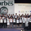 Tạp chí Forbes Việt Nam vinh danh 50 công ty niêm yết tốt nhất năm 2014. (Ảnh: Hoàng Hải/TTXVN)