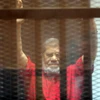 Ông Mohamed Morsi tại phiên tòa ở Cairo, Ai Cập ngày 7/5. (Nguồn: EPA/TTXVN)