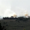 Máy bay quân đội Ukraine bốc cháy sau khi bị bắn rơi. (Nguồn: AFP/TTXVN)