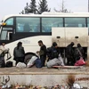 Quân nổi dậy Syria rời khỏi Aleppo ngày 22/12/2016. (Nguồn: AFP/TTXVN)