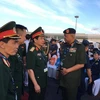 Trung tướng Phan Văn Giang (giữa) dẫn đầu Đoàn Việt Nam tham dự triển lãm. (Ảnh: Lê Hòa/Vietnam+)