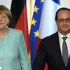 Thủ tướng Đức Angela Merkel và Tổng thống Pháp Francois Hollande. (Nguồn: AFP)