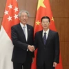 Phó Thủ tướng Trung Quốc Trương Cao Lệ (ảnh, phải), và người đồng cấp Singapore Tiêu Chí Hiền (ảnh, trái) trong một cuộc gặp. (Nguồn: THX/TTXVN) 