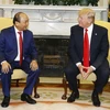 Thủ tướng Nguyễn Xuân Phúc và Tổng thống Hợp chúng quốc Hoa Kỳ Donald Trump. (Ảnh: Thống Nhất/TTXVN)
