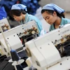 Công nhân trong một nhà máy ở Trung Quốc. (Nguồn: South China Morning Post)