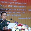 Thượng tướng Chansamone Chanyalath, Ủy viên Bộ Chính trị, Bộ trưởng Quốc phòng Lào phát biểu tại míttinh. (Ảnh: Phạm Kiên/Vietnam+)