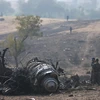 Hiện trường một vụ máy bay chiến đấu rơi ở Ấn Độ hồi năm 2011. (Nguồn: AFP/TTXVN)