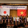 Chủ tịch FPT Trương Gia Bình cũng các đại biểu cắt băng khai trương Trung tâm nghiên cứu - phát triển của FPT (FPTOkinawa R&D) tại Okinawa, Nhật Bản. (Ảnh: Thành Hữu/Vietnam+)