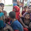 Người tị nạn Hồi giáo Rohingya sống sót sau vụ đắm thuyền ở Teknaf ngày 16/10. (Nguồn: AFP/TTXVN)