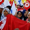 Người dân tuần hành ở Tunis ngày 14/1, đánh dấu 7 năm diễn ra các cuộc biểu tình lật đổ nhà lãnh đạo Ben Ali tại Tunisia ngày 14/1. (Nguồn: THX/TTXVN)
