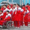 Phái đoàn Triều Tiên tới tham dự Paralympic PyeongChang 2018 tại lễ đón ở làng vận động viên PyeongChang, Hàn Quốc ngày 8/3. (Nguồn: Kyodo/TTXVN)