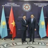 Bộ trưởng Tô Lâm và ông Karim Massimov, Chủ tịch Ủy ban An ninh Quốc gia Kazakhstan. (Ảnh: Quang Vinh/TTXVN)