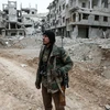 Phiến quân Syria tại Đông Ghouta ngày 15/2. (Nguồn: AFP/TTXVN)