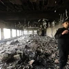 Hiện trường đổ nát sau một vụ tấn công ở Libya. (Nguồn: THX/TTXVN)