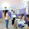 Cử tri bỏ phiếu tại một điểm bầu cử ở Baghdad, ngày 12/5. (Nguồn: THX/TTXVN)
