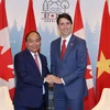 Thủ tướng Nguyễn Xuân Phúc và Thủ tướng Canada Justin Trudeau hội đàm hẹp. (Ảnh: Thống Nhất/TTXVN)