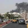 Khói bốc lên trong vụ hỏa hoạn tại nhà kho chứa phiếu bầu ở Baghdad ngày 10/6. (Nguồn: THX/TTXVN)