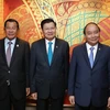 Thủ tướng Nguyễn Xuân Phúc làm việc với Thủ tướng Lào Thongloun Sisoulith và Thủ tướng Campuchia Samdech Techo Hun Sen. (Ảnh: Thống Nhất/TTXVN)