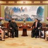 Nhà lãnh đạo Triều Tiên Kim Jong-un (giữa, trái) và Chủ tịch Trung Quốc Tập Cận Bình. (Nguồn: Yonhap/TTXVN)