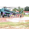 Người dân sơ tán khỏi khu vực nguy hiểm sau sự cố vỡ đập thủy điện ở Attapeu, Lào. (Nguồn: KPL/TTXVN)