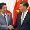 Thủ tướng Nhật Bản Shinzo Abe (trái) và Chủ tịch Trung Quốc Tập Cận Bình. (Nguồn: Kyodo) 