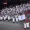 Tại lễ khai mạc Olympic PyeongChang 2018 ngày 9/2, đoàn vận động viên Hàn Quốc và Triều Tiên đã cùng diễu hành chung dưới lá cờ thống nhất. (Nguồn: AFP/TTXVN)
