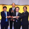 Thủ tướng Nguyễn Xuân Phúc chứng kiến Lễ khai trương các đường bay của Hãng hàng không VietjetAir đến Nhật Bản. (Ảnh: Thống Nhất/TTXVN)