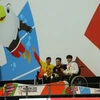 Võ Thanh Tùng nhận huy chương bạc ở nội dung bơi 50m tự do hạng S5. (Ảnh: Hải Ngọc/Vietnam+)