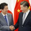 Chủ tịch Trung Quốc Tập Cận Bình (phải) và Thủ tướng Nhật Bản Shinzo Abe. (Nguồn: Kyodo)