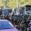Lực lượng đặc nhiệm phong tỏa hiện trường vụ nổ tại Trường cao đẳng khu vực Kerch, Bán đảo Crimea ngày 17/10. (Nguồn: AFP/TTXVN) 