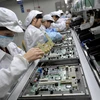 Bên trong nhà máy sản xuất điện thoại ở Thâm Quyến, Trung Quốc. (Nguồn: AFP/Getty Images)