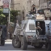 Cảnh sát Ai Cập gác trên đường phố tại khu vực Al-Arish, Bắc Sinai ngày 26/7. (Nguồn: AFP/TTXVN) 
