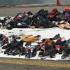 Những đôi giày và túi xách, balô của các nạn nhân xấu số. (Ảnh: Đỗ Quyên/Vietnam+) 