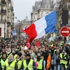 Người biểu tình "Áo vàng" tập trung tại thủ đô Paris của Pháp, ngày 12/1 vừa qua. (Ảnh: AFP/TTXVN)