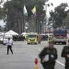 Lực lượng an ninh và nhân viên cứu hỏa làm nhiệm vụ tại hiện trường vụ đánh bom xe ở Bogota, Colombia, ngày 17/1/2019. (Nguồn: THX/TTXVN) 