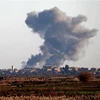 Khói bốc lên sau các cuộc không kích ở Syria. (Nguồn: AFP/TTXVN) 