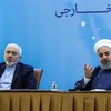 Tổng thống Iran Hassan Rouhani (phải) và Ngoại trưởng Iran Mohammad Javad Zarif (trái) tại cuộc họp ở Tehran, Iran, ngày 22/7/2018. (Nguồn: AFP/TTXVN) 