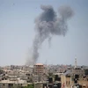 Khói bốc lên sau các cuộc không kích do quân đội Israel tiến hành tại thành phố Rafah, Dải Gaza ngày 14/7/2018. (Nguồn: THX/TTXVN) 